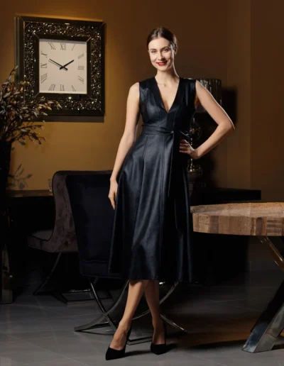 Elegant black sleeveless midi dress with a belted waist.