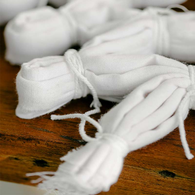 Recycled fabric rolls and eco-conscious packaging materials used at Ibex Fashion’s sustainable clothing factory in the USA with global shipping.