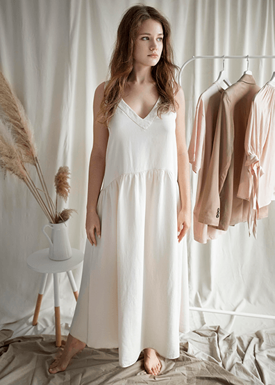 Clarabella midi dress in luxe crepe fabric featuring a boat neckline, low scoop back, panelled seams, and a voluminous tulle skirt.